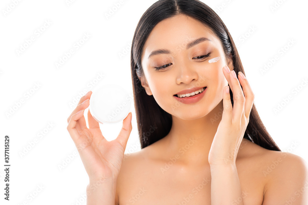 naked asian woman applying cosmetic cream on face isolated on white naked asian woman applying cosmetic cream on face isolated on white
