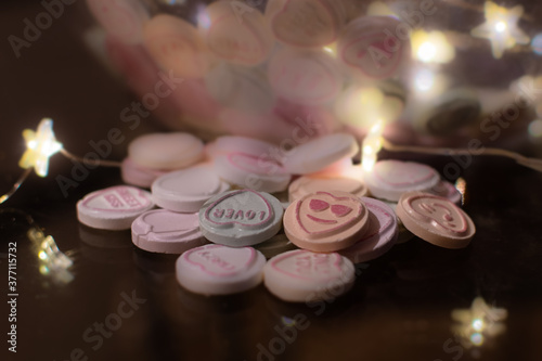 Romantic sweets and candy displayed with fairy lights.