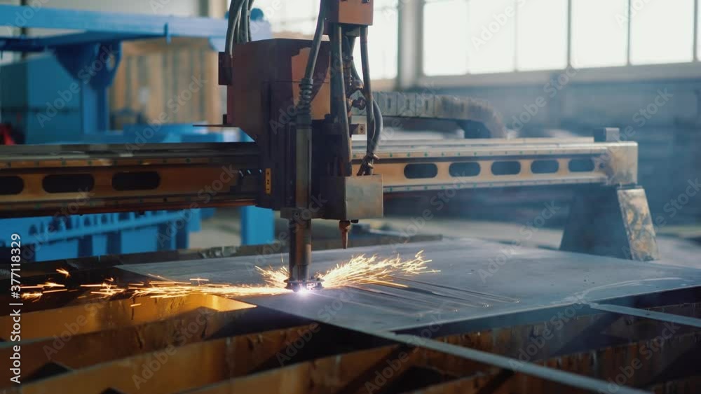 Automated plasma cutting of metal sheet on modern laser cnc machine on factory