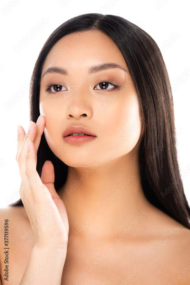 Asian woman looking away and touching face isolated on white Asian woman looking away and touching face isolated on white
