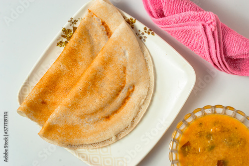 Tasty south Indian Dosa with curry ready to be served
