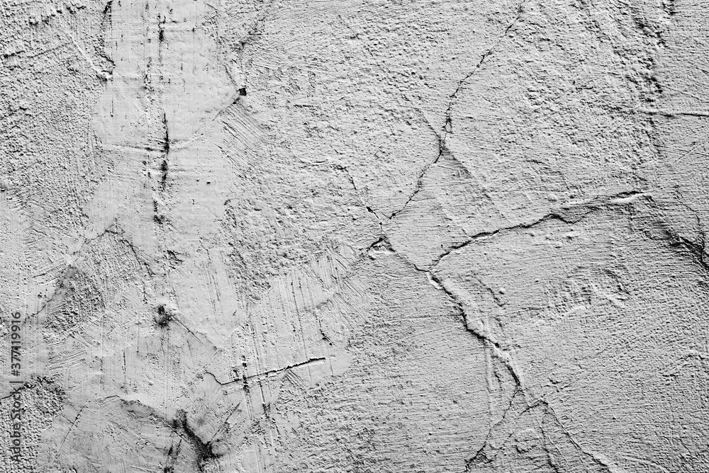 Obraz premium Texture of a concrete wall with cracks and scratches