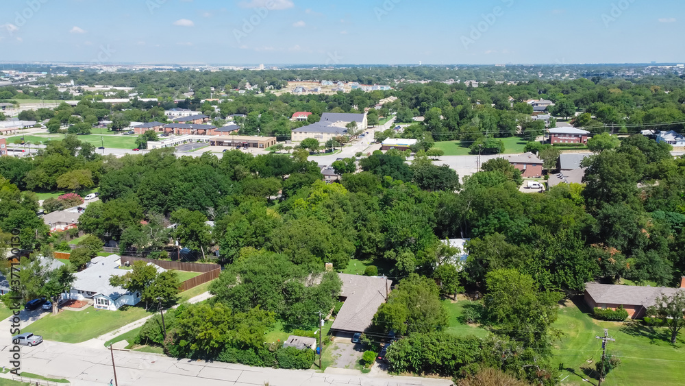 Top view green residential area outside historic downtown Carrollton, Texas