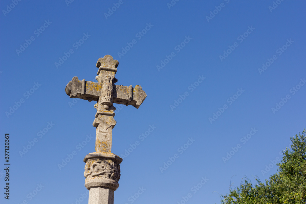 Stone cross at the entrance of a village