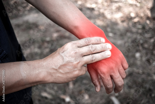 Man holding his hand and body - pain concept