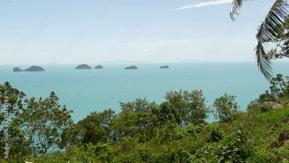 Five Sisters Islands in serene water surface. Enchanting landscape, greenery and deep calm water, Samui Thailand. Relax travel vacation holiday resort concept. Bird eye panoramic aerial drone top view