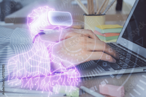 AR hologram with man working on computer on background. Augmented reality concept. Double exposure.