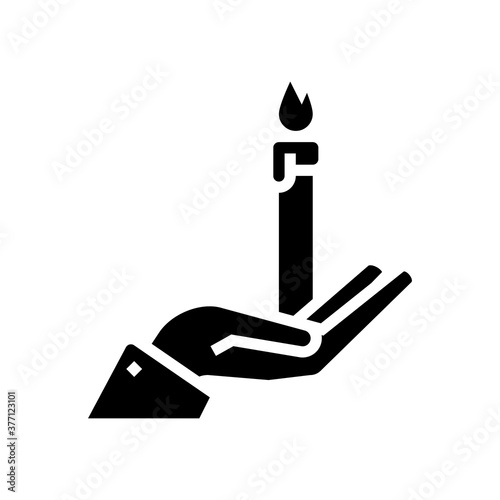 hand holding burning candle glyph icon vector. hand holding burning candle sign. isolated contour symbol black illustration © vectorwin