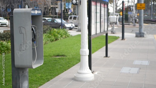 Obraz na płótnie Retro coin-operated payphone station for emergency call on street, California USA