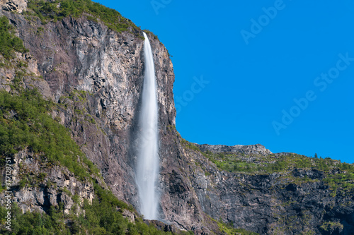 Stunning views the mountains and waterfalls surrounding of the Naeroyfjord, listed as a UNESCO World Heritage Site in the Aurland Municipality in Vestland county, Norway. photo