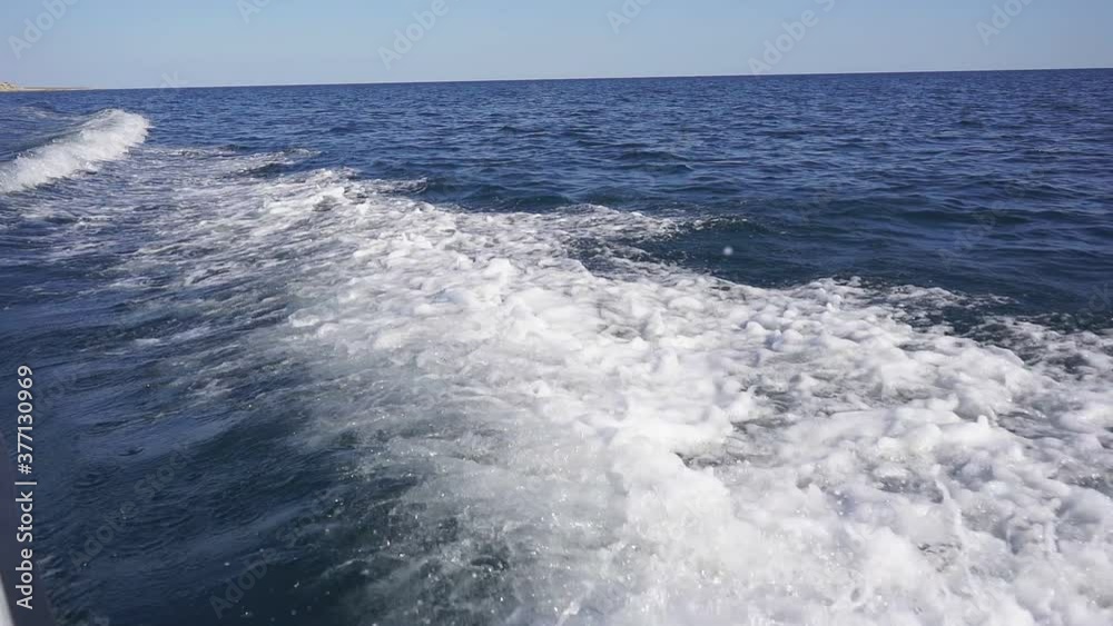Motor boat goes fast on the sea and creates large splashes, waves above the surface of the water. slow-motion Motor boat goes fast on the sea and creates large splashes, waves above the surface of the water. slow-motion