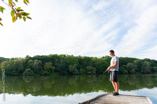 Young man fishing in the river