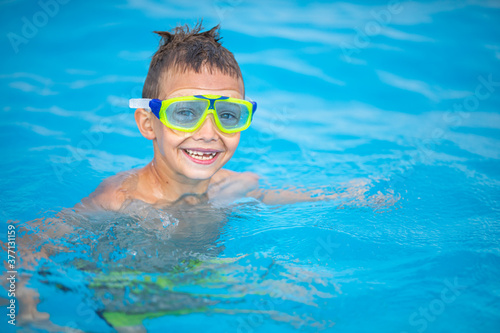 Cute little boy in a swimming pool © lightpoet