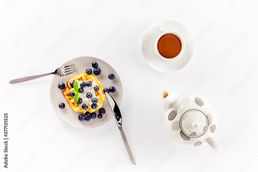 Homemade belgian waffles on served table on white background top view mockup Homemade belgian waffles on served table on white background top view mockup
