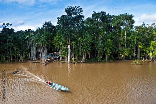 Ribeirinho em canoa a motor na Ilha do Marajo. photo