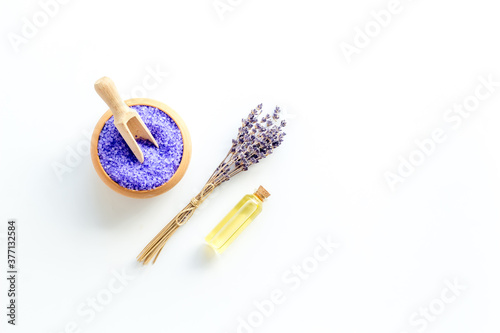 Lavender spa set. Violet bath salt and essence oil on white background