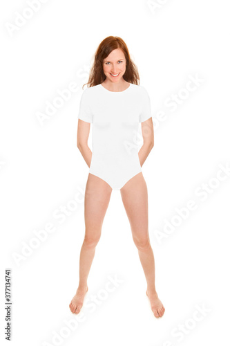 Full length portrait of an attractive cheerful woman wearing a white bodysuit, studio photo isolated in front of white background © Jochen Schönfeld