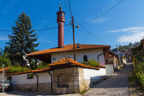 View of an ancient wooden Arebi Atik mosque in the historic district of Sarajevo. Bosnia and Herzegovina photo