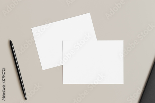 Two white invitation cards mockup, 5x7 ratio, similar to A6, A5. Workspace concept.