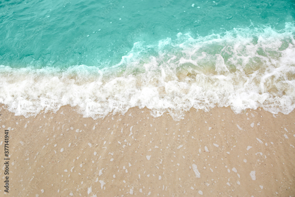 Beautiful view of sea tide on sandy beach. Summer vacation Beautiful view of sea tide on sandy beach. Summer vacation