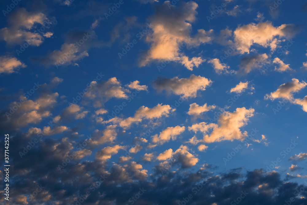 Picture of magical clouds. The background of a bright sky with clouds.Voluminous foamy air clouds in a blue sky.