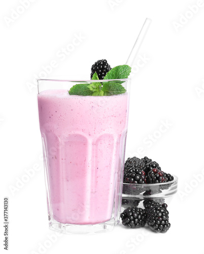 Tasty blackberry milk shake with fresh berries and mint isolated on white