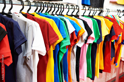 Colored t-shirts on hanger in store
