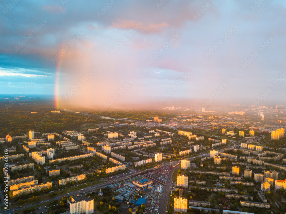 Rainbow and rain over Kiev city. Aerial drone view.