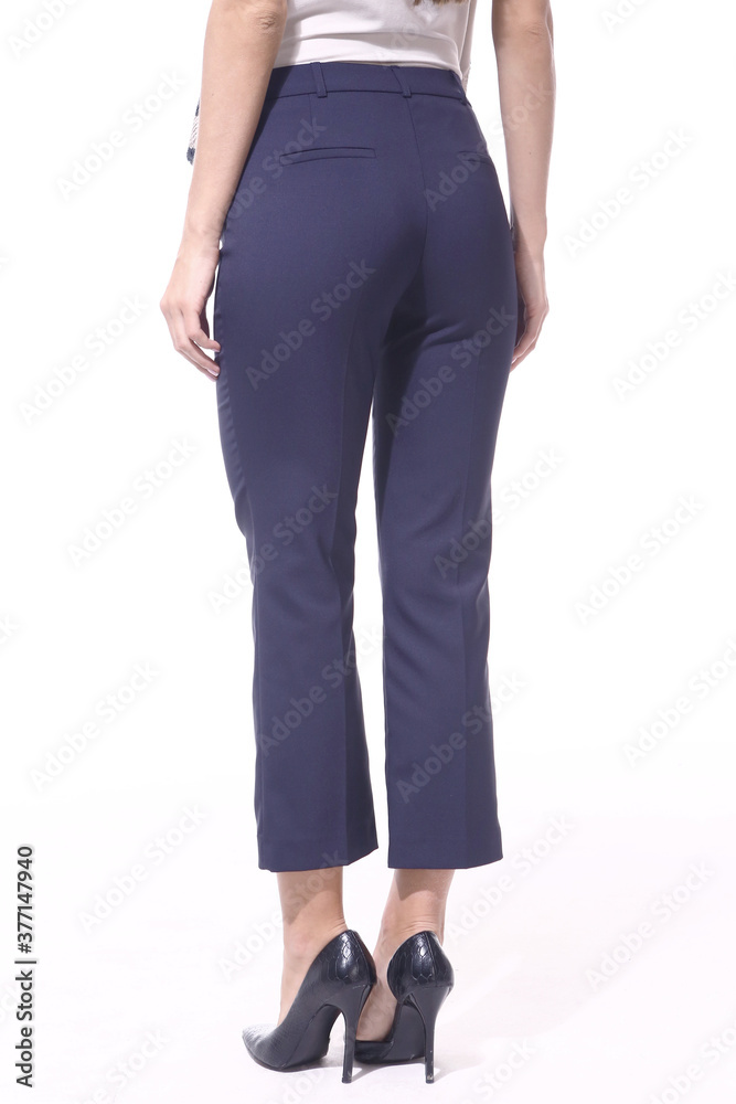 official formal short trousers on model legs, high heels shoes close up photo isolated on white official formal short trousers on model legs, high heels shoes close up photo isolated on white
