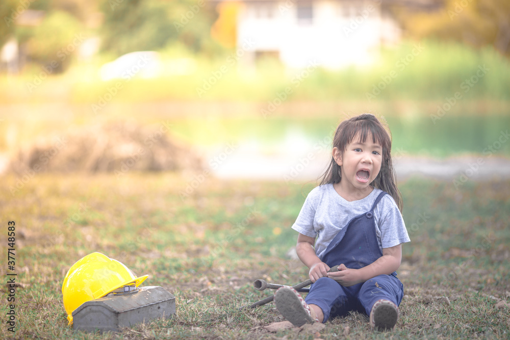 Close-up view of cute Asian young girls Who are simulating learning outside of the classroom, event planning, designing on the mechanic, with assembly to