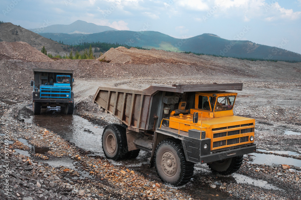 The mountainous dump truck is widely used for transporting and unloading rocks. Mining.