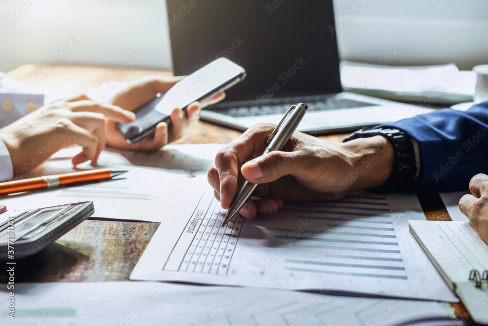 businessman working in office with using a calculator to calculate the numbers finance accounting concept businessman working in office with using a calculator to calculate the numbers finance accounting concept