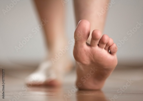 The foot of a person walking forward. Close up © OB production
