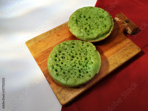 Sarabi pancake on a wooden cutting board photo