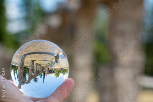 Background with ancient abbey of San Vincenzo seen through a crystal ball  central Italy landscapes.