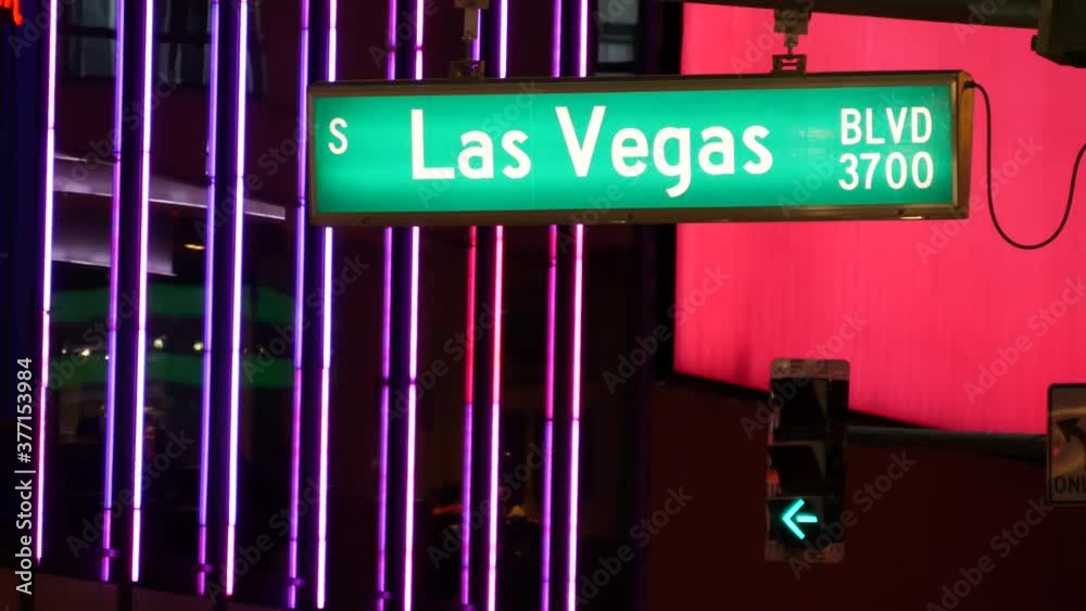 Fabulos Las Vegas, traffic sign glowing on The Strip in sin city of USA. Iconic signboard on the road to Fremont street in Nevada. Illuminated symbol of casino money playing and bets in gaming area. Fabulos Las Vegas, traffic sign glowing on The Strip in sin city of USA. Iconic signboard on the road to Fremont street in Nevada. Illuminated symbol of casino money playing and bets in gaming area.