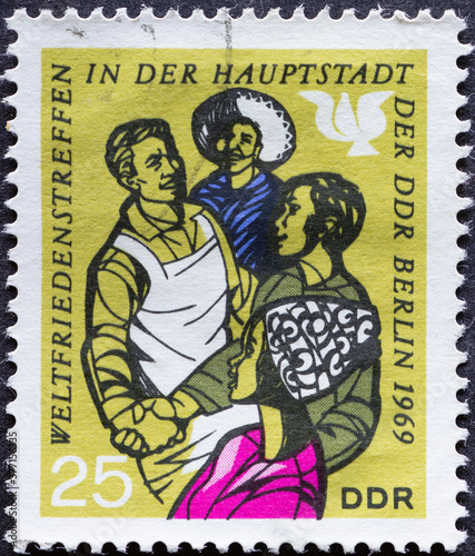 GERMANY, DDR - CIRCA 1969: a postage stamp from Germany, GDR showing people to the world peace meeting