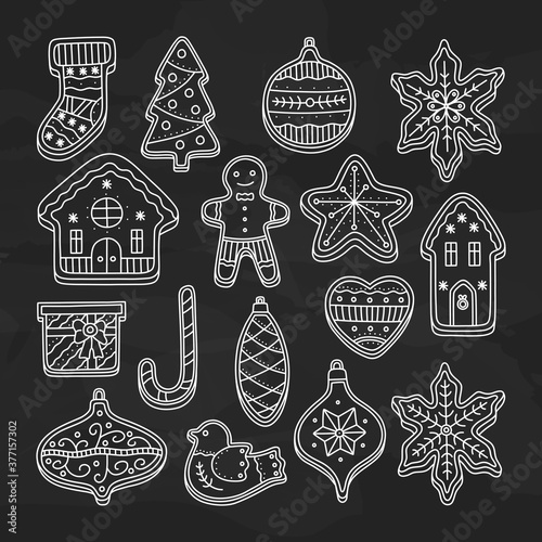 Big collection of Christmas gingerbread cookies, house, man with glaze for decoration. Biscuit for happy Xmas. Vector illustration in doodle style, isolated on black chalkboard background.