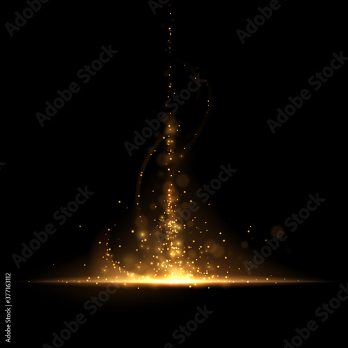 Abstract gold light sparks on black background photo