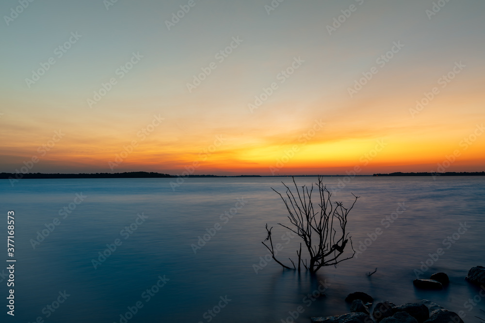 Lake Lavon sunrise during a warm summer morning near Dallas, TX, USA. Lake Lavon sunrise during a warm summer morning near Dallas, TX, USA.