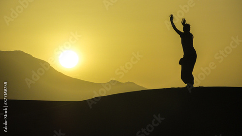 silhouettes sunrise in the desert