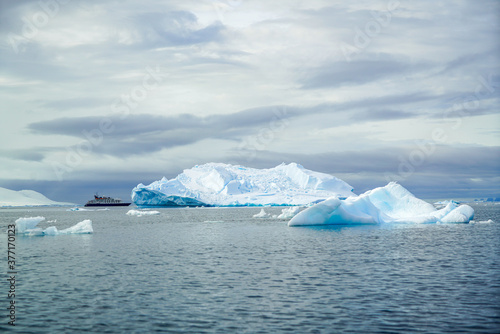 Antarctica, Antarctic Peninsula, cruising in the Lemaire Channel. Ice covered mountain and ice floes. 2020 