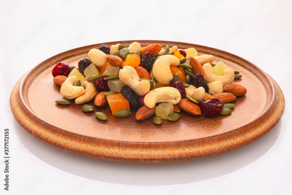 The plate contains nutritious mixed nuts The plate contains nutritious mixed nuts