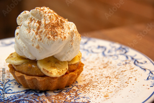 Banoffee Pie. Traditional English dessert prepared with banana and dulce de leche or caramel photo