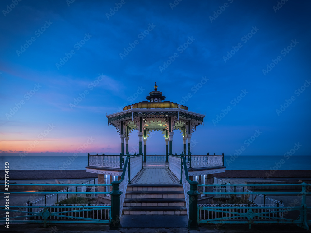 A spectacular dawn rises behind the bandstand on Brighton seafront