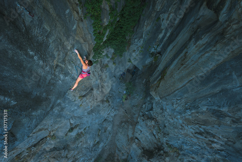 Powerful female sport climber photo