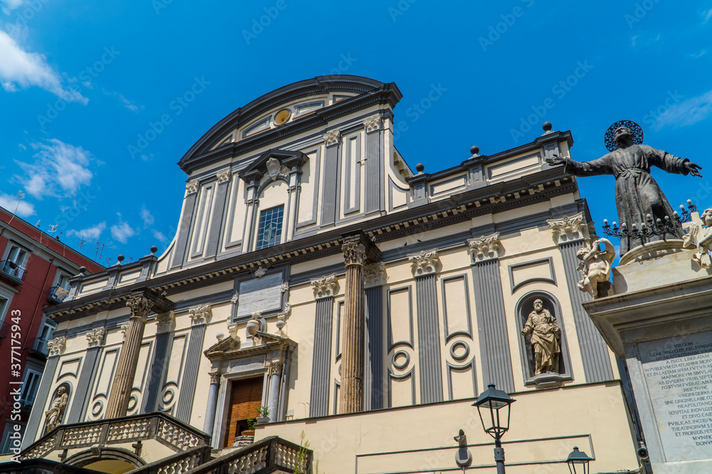 View of Basilica di San Paolo Maggiore in the historic center of Naples, Italy with angel statue