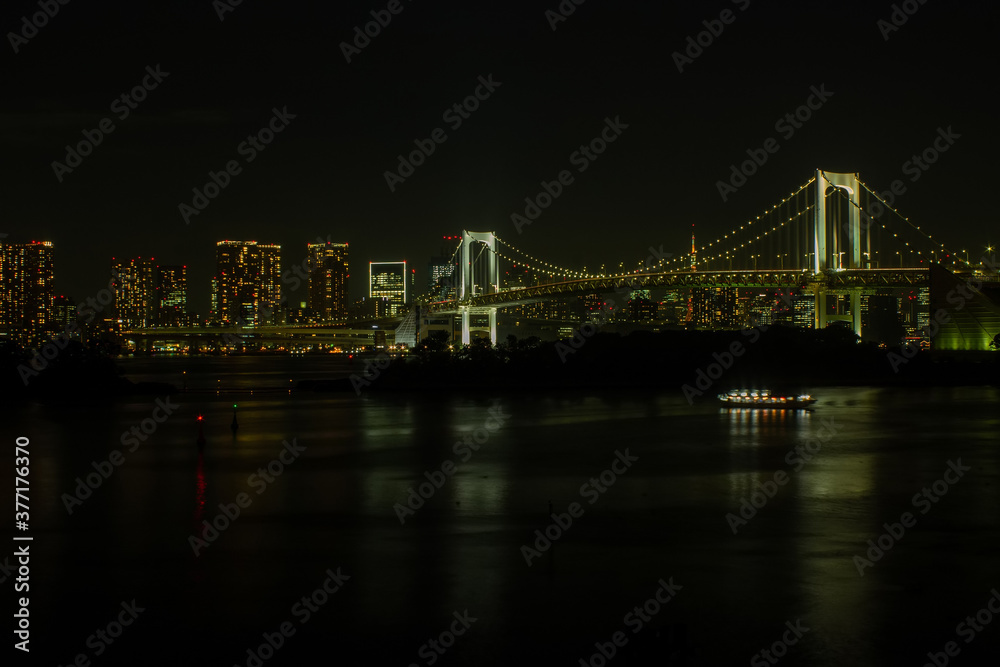 A view of Tokyo at night with yellow lights