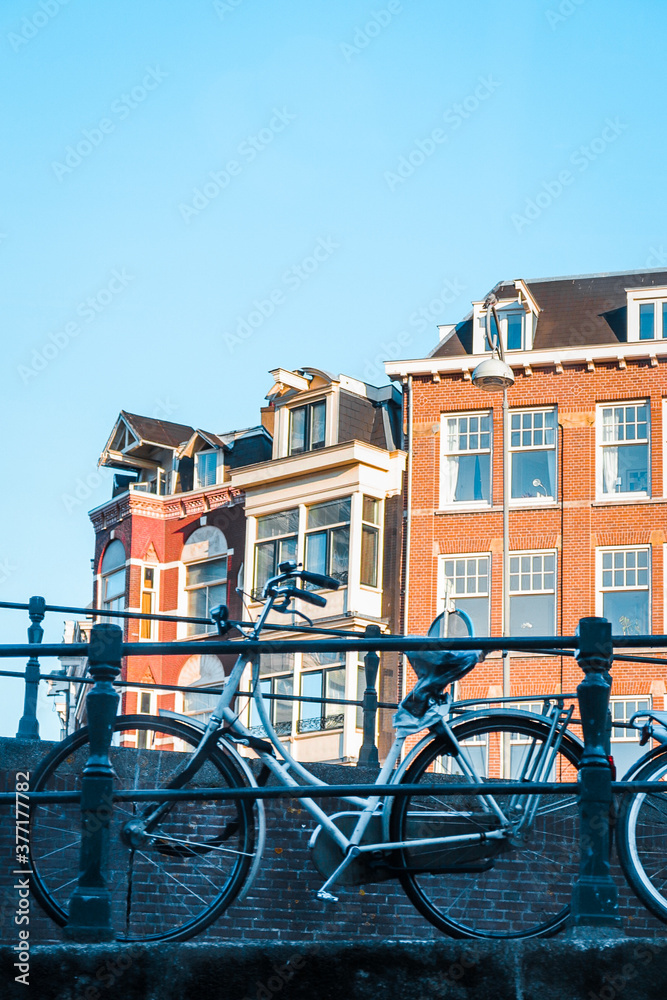 Bike in front of canal houses