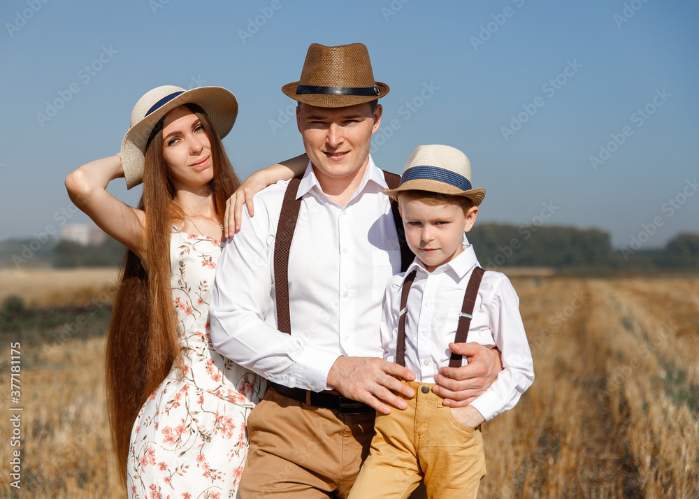 parents and a child in the field